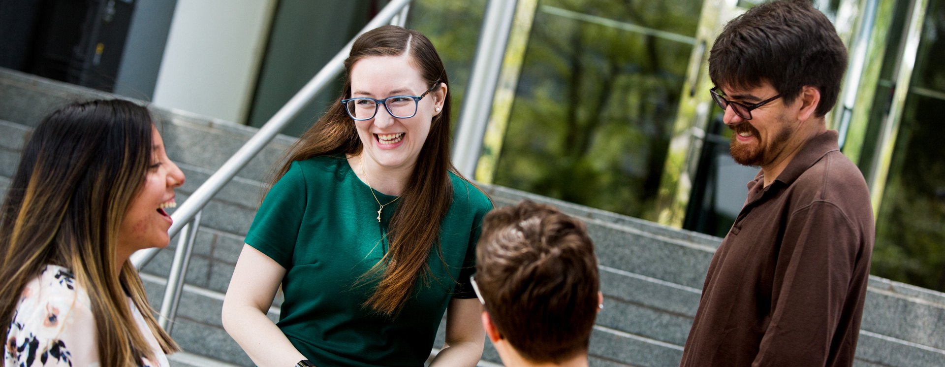 A group of ASCE members share a laugh on the steps of the ASCE Headquarters in Reston, Virginia.