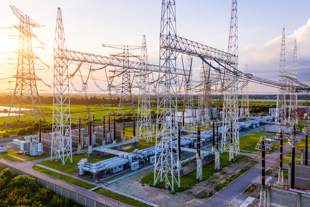 substation towers in green field