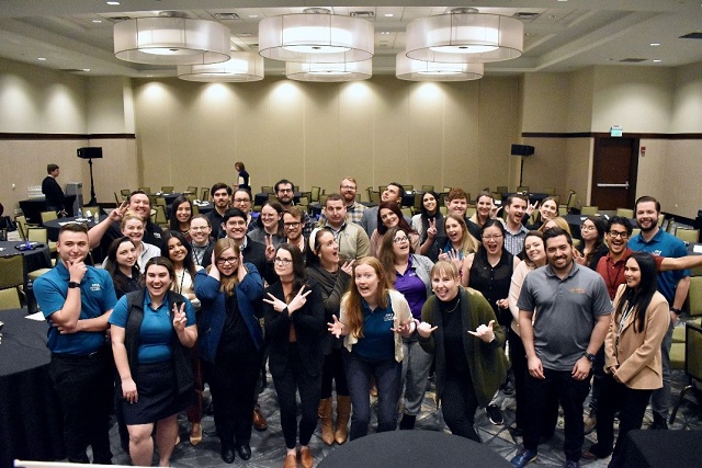  MRLC 2023 Younger Member Council group photo. Pictured are 36 people facing the camera making funny faces in a banquet hall.