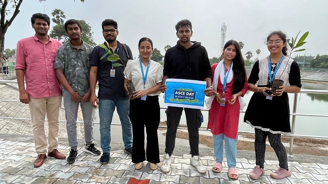 7 people facing the camera smiling. 1 person is holding an ASCE Day sign.