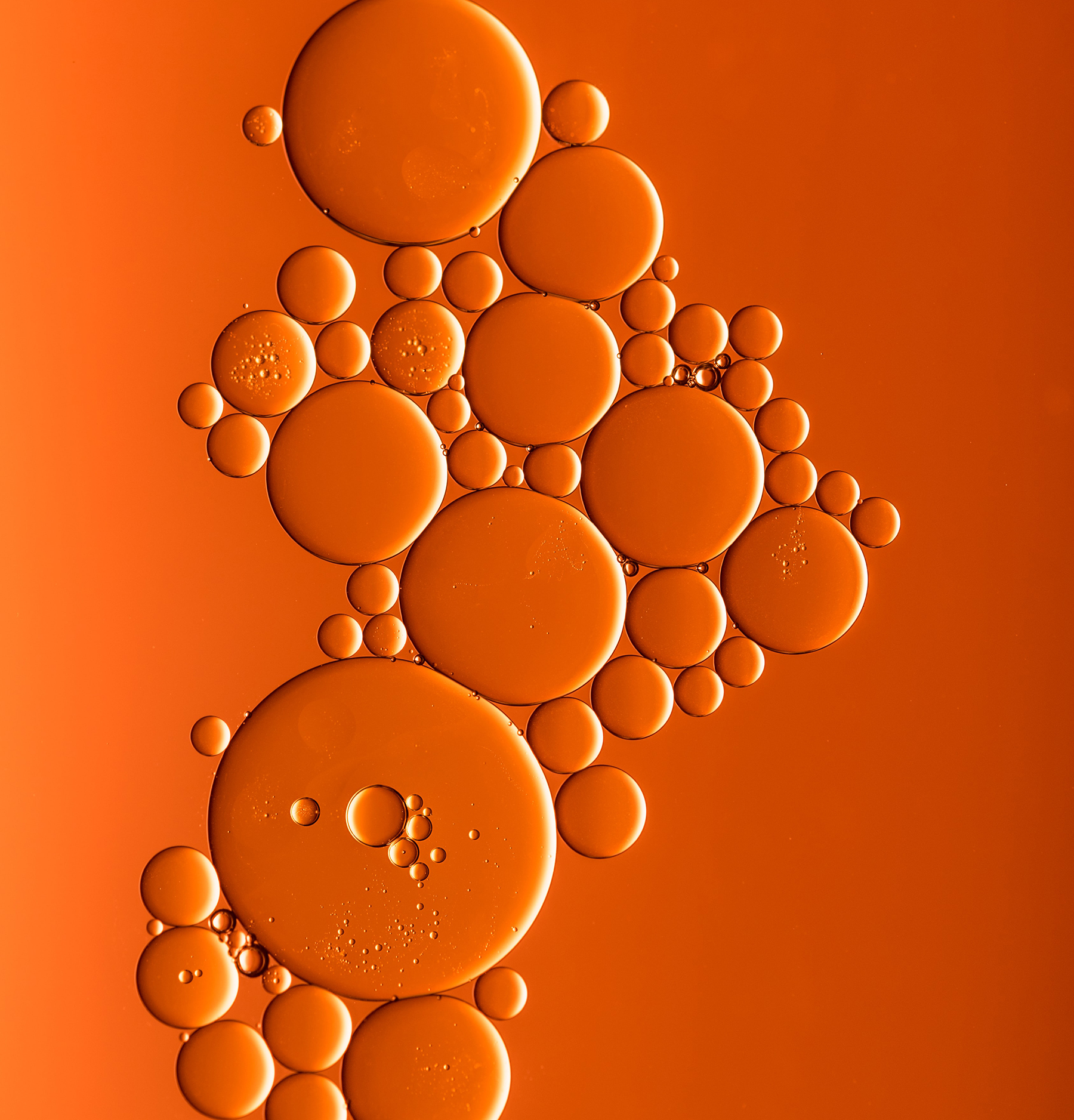 BUBBLES AGAINST ORANGE BACKGROUND