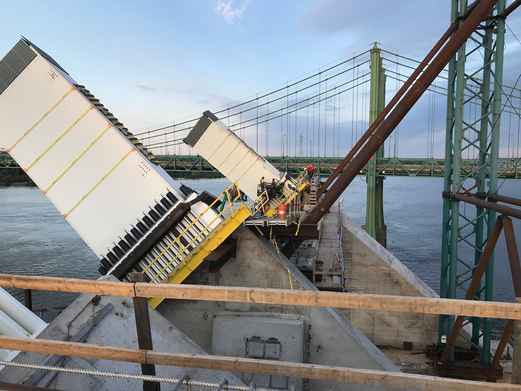 Photos shows an aerial view of the new and existing twin-span bridges.