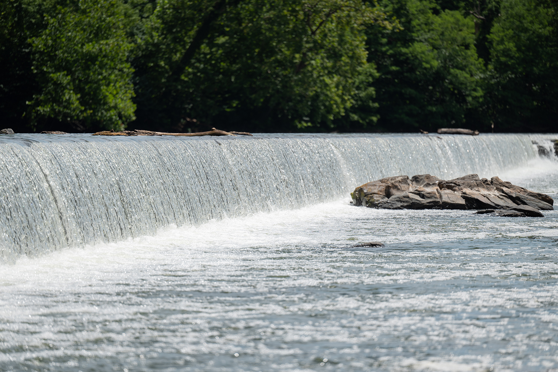 Photo of a low head dam by Mark Stenglein on Unsplash