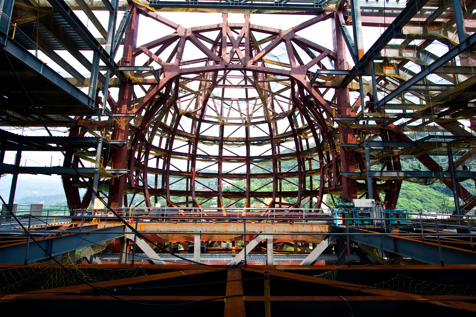 In-construction photo of the structural steel used to create the globe-shaped auditorium.