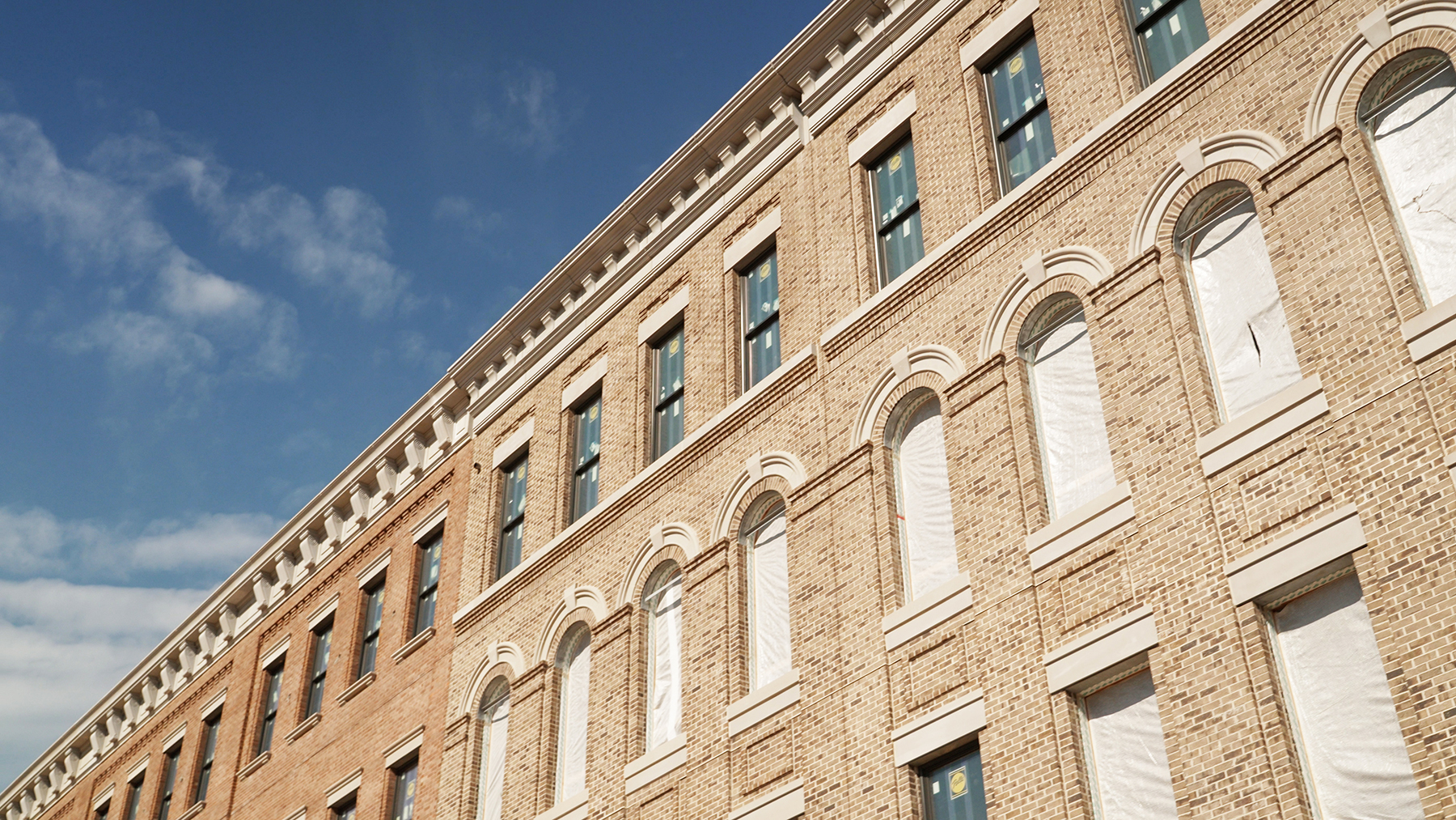 The photograph shows a closeup of a filmable brick facade.