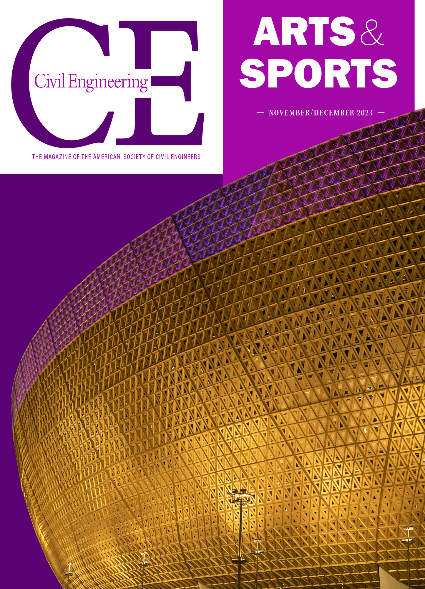 A large, curved structure with a golden facade is lit up at night. 