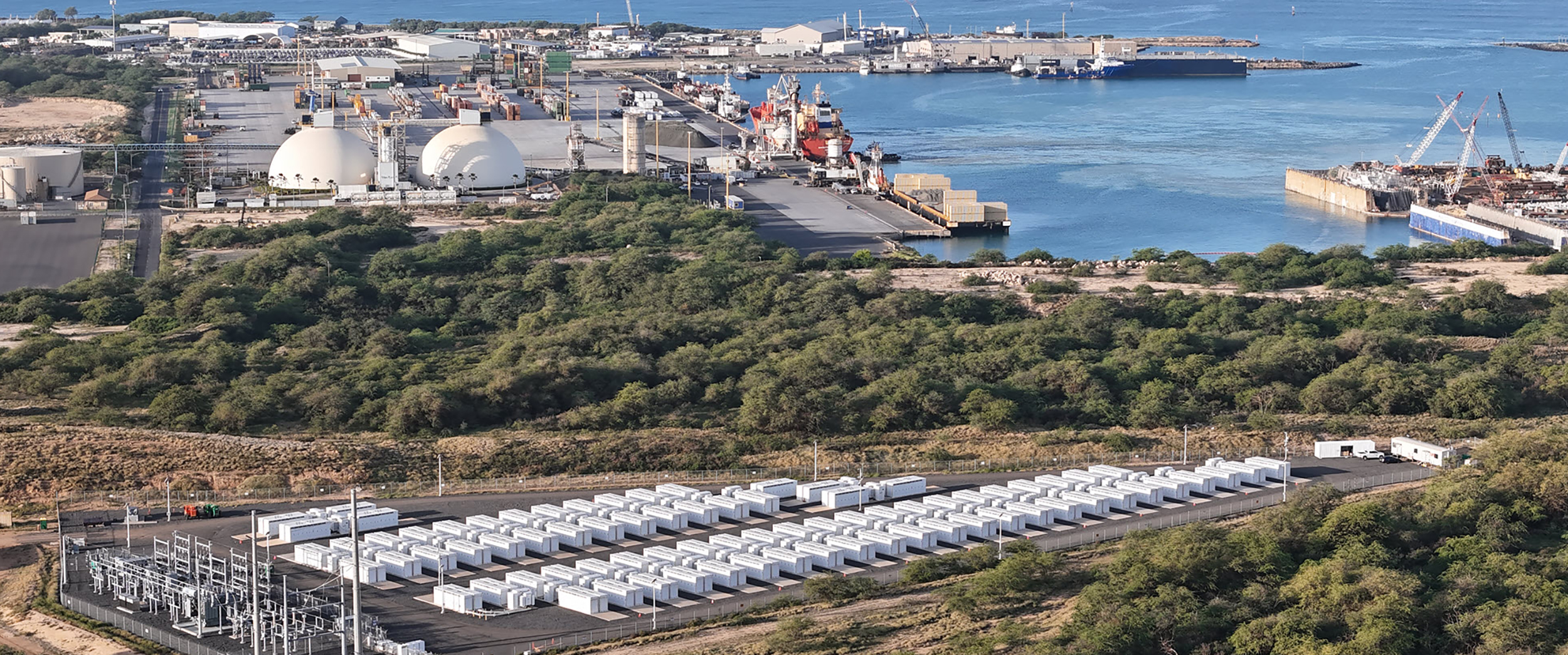 view of oversized batteries near a waterfront