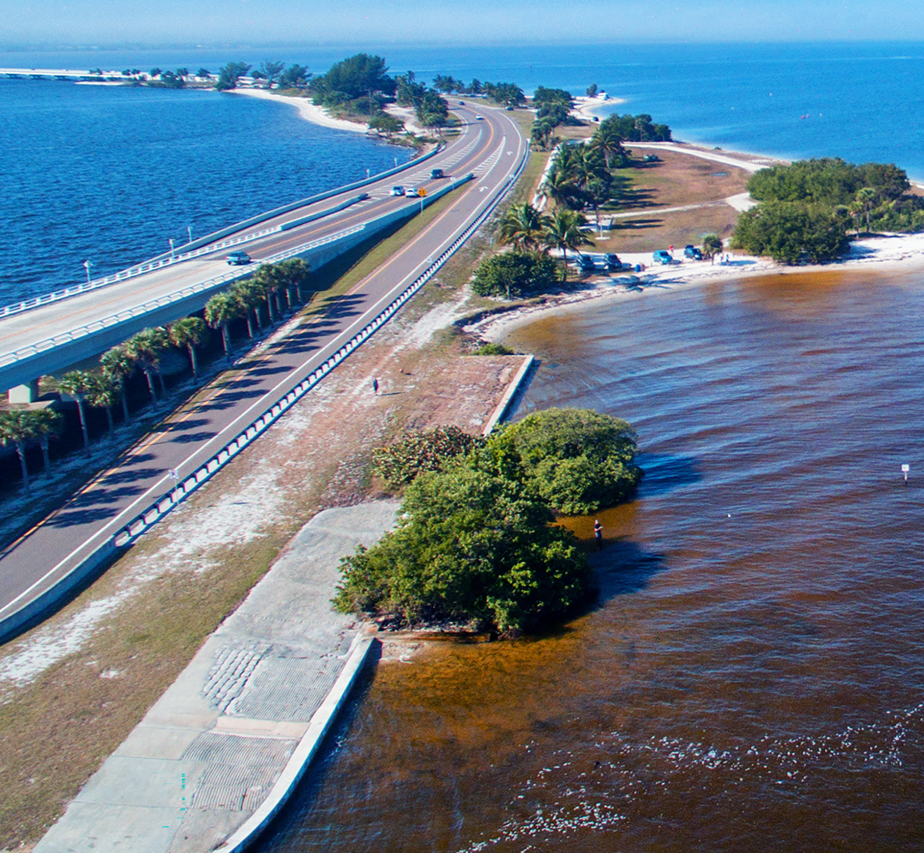 Image of waterway with shoreline and street Image courtesy of Adobe Stock