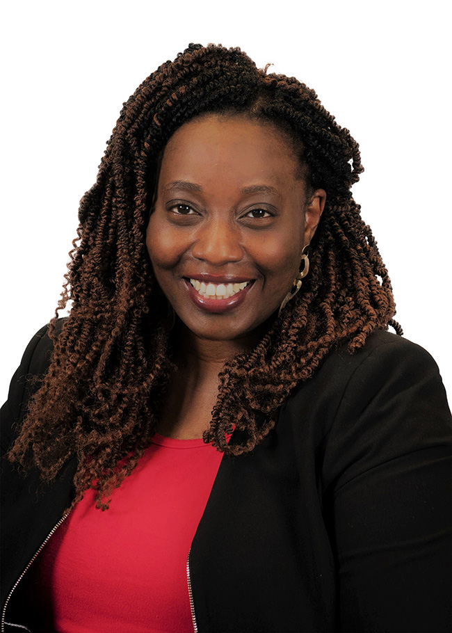 Woman smiles at the camera. 
