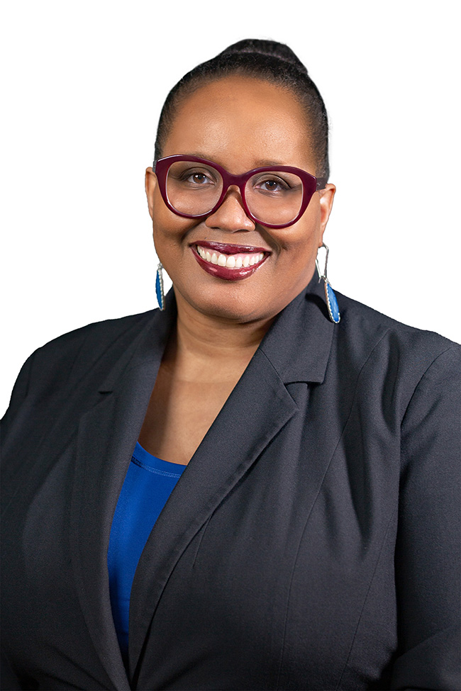Woman smiles at the camera. 