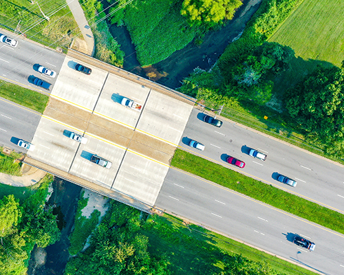 Aerial view of roadway and bridge over a creek