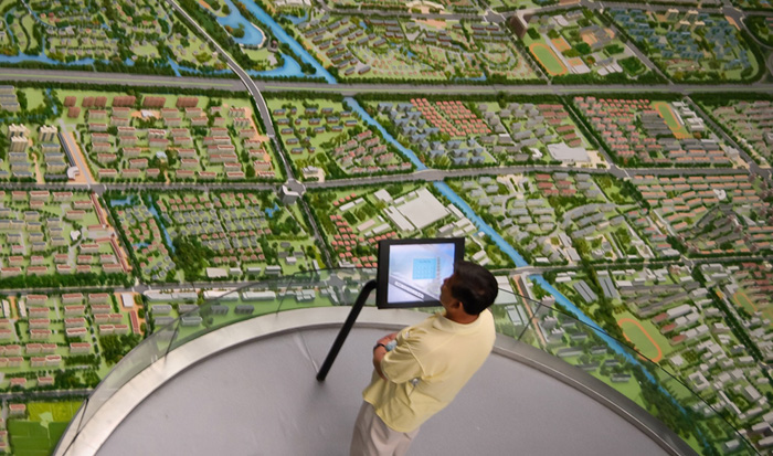 Surveyor assessing landscape with an aerial view
